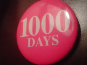 A red button with "1000 Days" on it.
